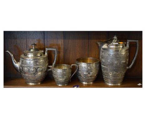 Late 19th Century silver plated four piece tea service decorated in the Indian style with signs of the zodiac and comprising: