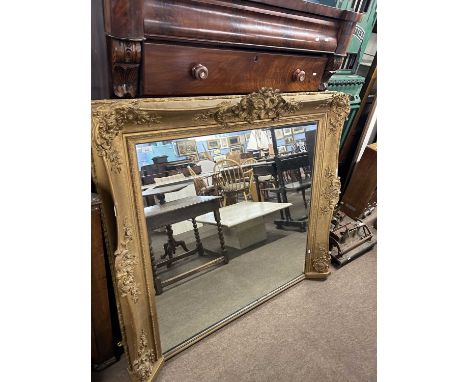 A large 19th Century gilt over mantel mirror with foliate moulded detail, 134cm x 120cm