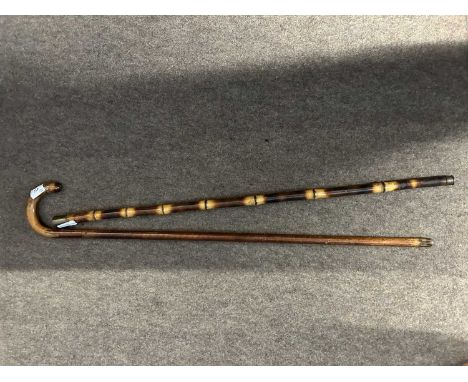 Vintage wooden sword stick with 'Toledo' blade together with a French bamboo example blade signed L Merionac