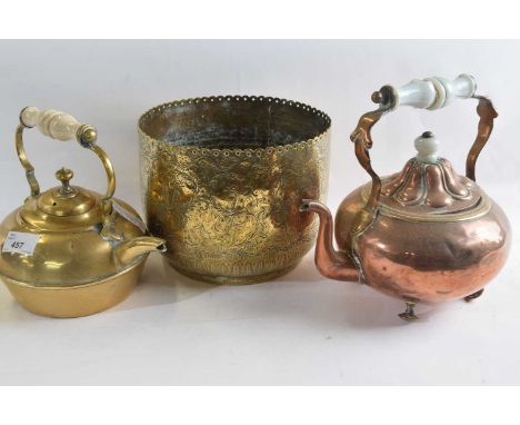 A brass late 19th Century kettle with ceramic handle, further copper example and a large brass dome
