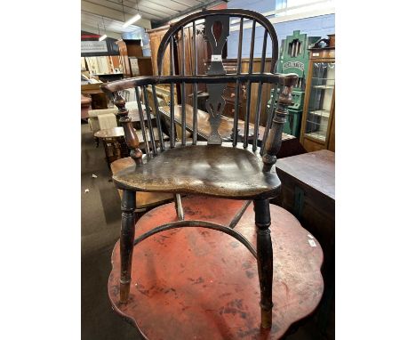 A small 19th Century elm seated and stick back Windsor chair with pierced splat back, turned legs and crinoline stretcher