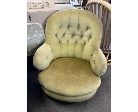 A Victorian button upholstered slipper type armchair on short turned legs with casters, 82cm high