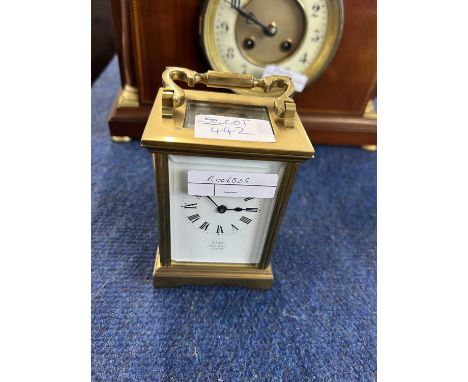 An early 20th Century brass carriage clock, the white enamel dial marked Dent, Pall Mall, London
