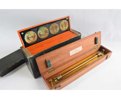 A boxed collection of lantern slides and measuring instrument marked G Thornton Ltd, Manchester, in original box