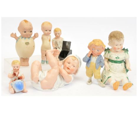 Collection of porcelain / bisque vintage ornaments x seven, including Wuwu Kewpie Elfie-type figure within egg (tip of little