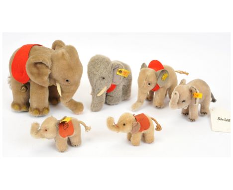 Steiff six vintage mainly miniature elephants: (1) Elephant, yellow tag 6317,00, 1959-1967, with button, cloth tag, chest tag
