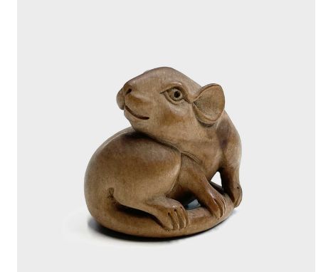 A Japanese carved wood netsuke in the form of a rat, Meiji period, signed, height 4cm, width 4cm.
