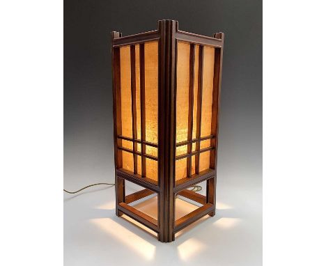A Chinese hardwood lamp, 20th century, with a pierced fretwork top, height 60cm, width 26.5cm, depth 26.5cm.