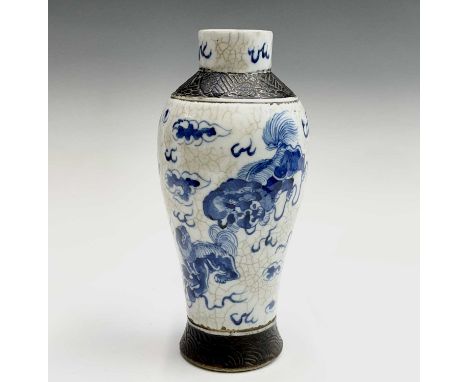 A Chinese blue and white crackle glazed vase, 19th century, the base with drilled seal mark and part paper label, height 25.5