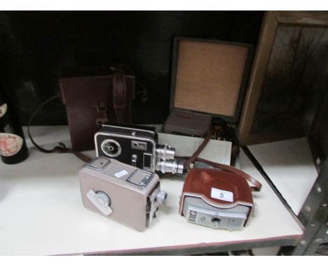 A mini slide projector kit, a leather cased cine camera, a Kodak Brownie movie camera and an Agfa Movex 88 camera