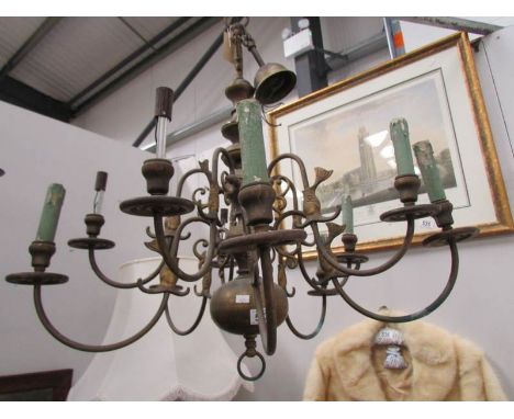 A large 8 lamp brass ceiling light