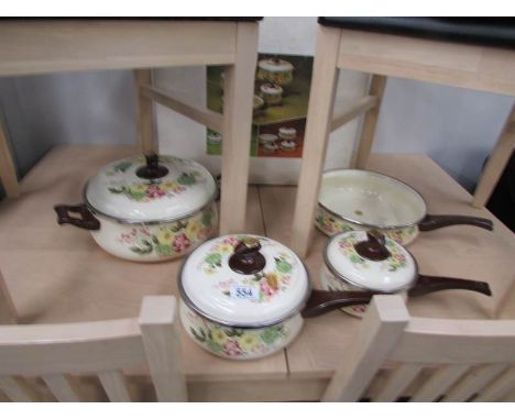 A set of 4 enamel pans