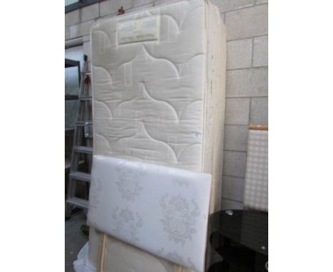 A single divan bed with headboard