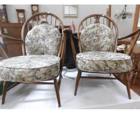 A pair of Ercol style fireside chairs