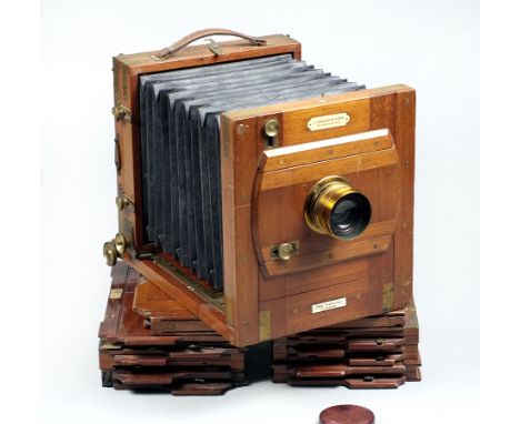 J Lancaster Half-Plate Wood & Brass Camera. Features brass bound corners and fitted with a Taylor Taylor & Hobson Cook Series