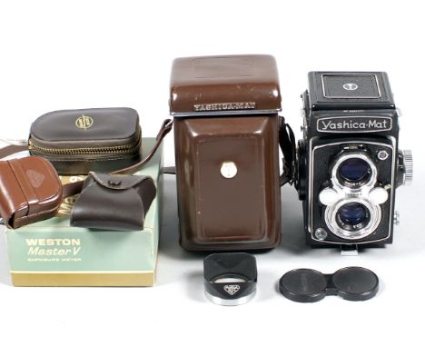 Yashica-Mat TLR 120 Camera. (condition 5F) with Yashinon 75mm f3.5 lens, case, cap and Rolleiflex 1R lens hood. Also a Weston