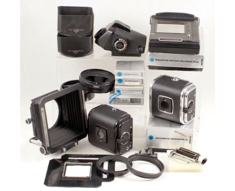 Quantity of Hasselblad Accessories. To include Polaroid Magazine 100;  Bellows Lens hood with inserts & adapter rings; Auto M