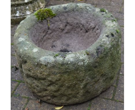 A circular Derbyshire gritstone hollowed out planter. 32cm high x 52cm diameter.