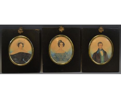 English School, 19th century, a portrait miniature, a lady, three-quarters, her hair in ringlets, watercolour on paper, oval,