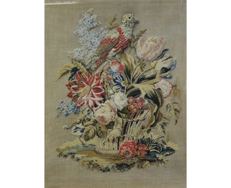 A Victorian needle and stump work sampler, embroidered with a parrot on a basket of flowers, 64cm x 52cm,  framed