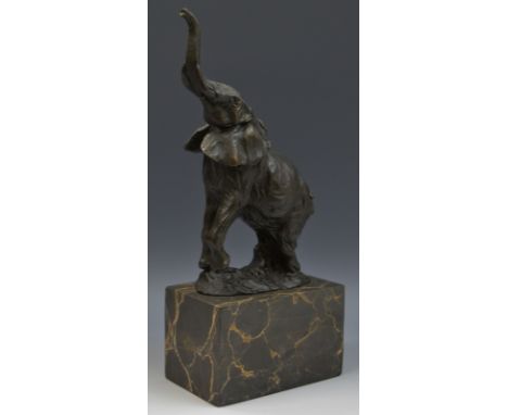 French  School,  a brown patinated cold cast sculpture, of an elephant, trunk raised, veined marble base, 31cm high, foundry 