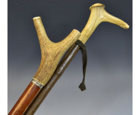 A holly walking stick, the horn handle with whistle, 100cm long;  another, 97cm long (2)