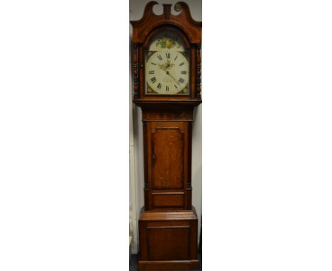 A 19th century oak and mahogany crossbanded longcase clock, the arched white painted dial with Roman numerals, floral spandre