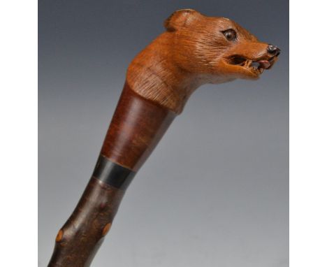 A blackthorn walking stick,  well  carved by Stan Randall,  with fox mask, 115cm long