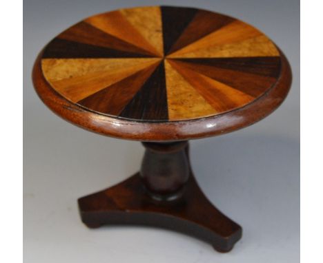 A Victorian specimen wood miniature breakfast table, circular top with radiating veneers of sample timbers, turned pillar, in