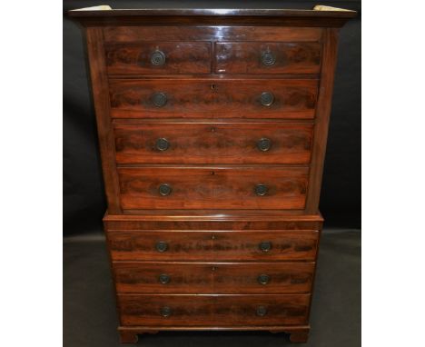 A George III flamed mahogany chest on chest, over sailing ogee cornice, two short above three long page veneered drawers, wai