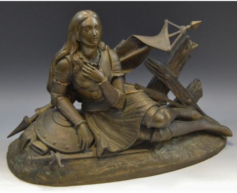 French School, a light brown patinated sculpture,  Joan of Arc, reclining with her sword and shield, 27cm high