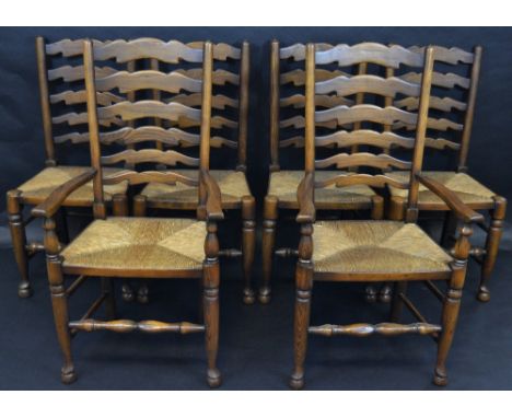 A set of six 19th century oak ladder back country dining chairs, raffia seats, turned forelegs and stretcher, club feet inclu