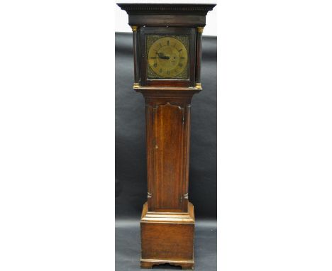 A George III Caygill of Askrigg oak longcase clock, stepped cornice, brass capped columns, square brass dial, floral spandrel