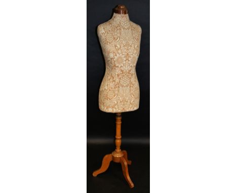 An early 20th century mannequin, copper top, tripod base, circa 1910/1920, modern William Morris upholstery