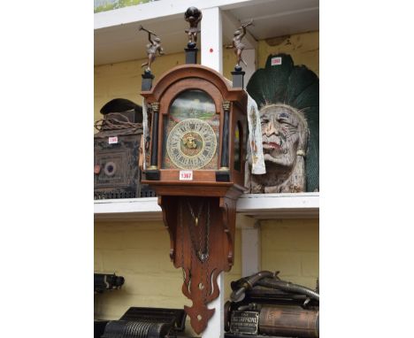A 17th century style mahogany and ebonized Dutch wall clock.   Condition Report:  This is a modern copy.  Does not appear to 