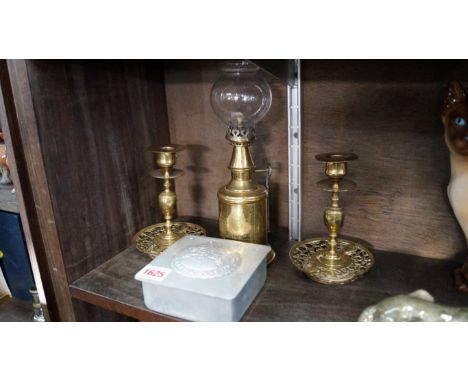 A pair of Victorian brass candlesticks, 14cm high; together with a French brass pigeon lamp; and a J S Fry & Sons Ltd bi-cent