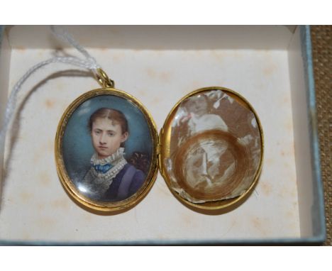 A Victorian head and shoulders portrait miniature of a young lady, on ivory 3.2 x 2.5cm oval, in an unmarked gilt locker. 