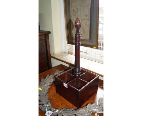 A Georgian style mahogany bottle stand, with pine cone finial, 46cm high.  