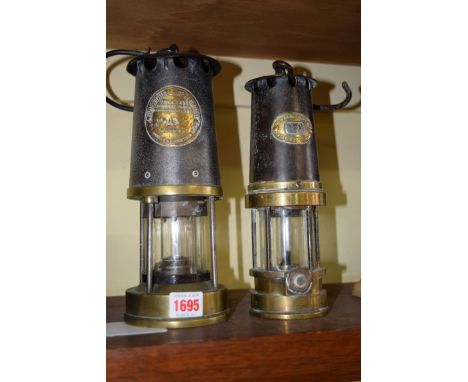 Two miner's lamps,  one inscribed 'Patterson Lamps Ltd' and numbered 192; the other 'Protector Lamp & Lighting Co Ltd' and nu