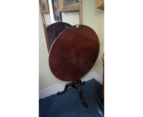 A George III mahogany circular tilt-top tripod table, with well figured single piece top and bird-cage action, 75.5cm diamete