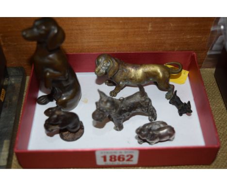 A bronze Dachshund, 9cm high; together with another similar; and four further metal animals. 