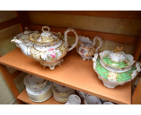 A 19th century English porcelain teapot and cream jug, possibly Rockingham; together with two further sucriers and covers.   