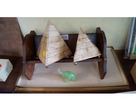 A graduated pair of bone veneered pyramids, largest 16cm high; together with an oak book trough; and a small green jadeite el