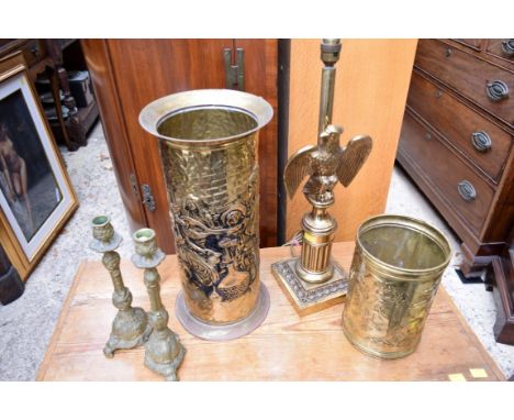 A brass eagle table lamp; together with a pair of brass candlesticks; a stickstand and another. 