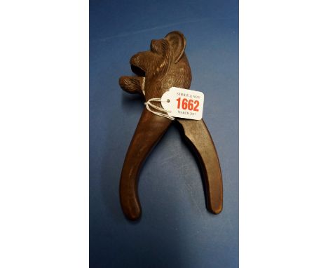 A Black Forest carved wood novelty monkey nutcracker.    Condition Report:  Appears to be in working order.  Slight nicks in 