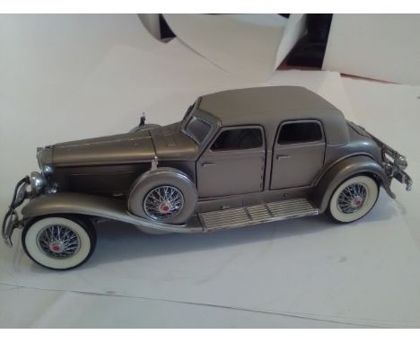 Duesenberg Franklin mint 1/24 scale model of a 1933 Silver Duesenberg Twenty Grand, Passenger door needs fixing. No box. High