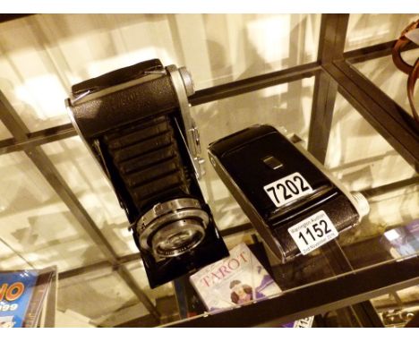 CAMERAS. Ensign Selfix 820 folding camera and a Kodak example