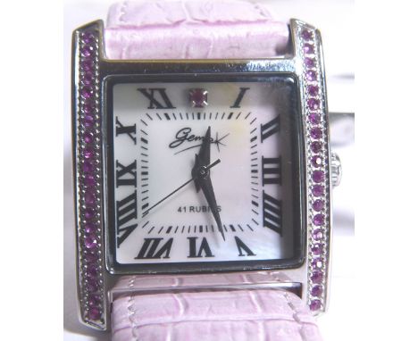RUBY WRISTWATCH. Mother of pearl faced wristwatch with 41 rubies