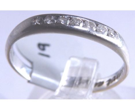 9CT ETERNITY RING. 9ct white gold seven stone diamond half eternity ring, size K/L