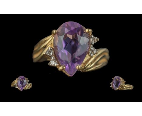 Ladies 14ct Gold Amethyst and Diamond Set Dress Ring of Pleasing Design. Marked 14ct to Interior of Shank. The Large Pear Sha